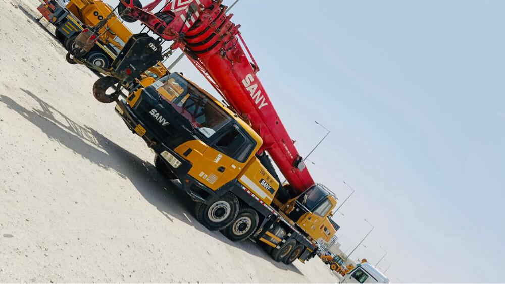 Two mobile cranes parked together